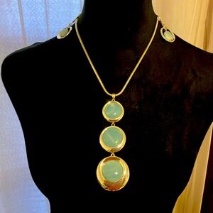 A beautiful silver necklace and earring set.